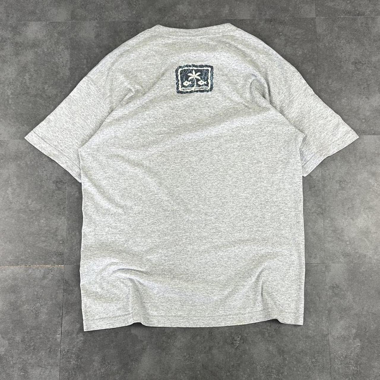 Alstyle Apparel 2000s Logo Waikiki Hawaii Tribal Pattern waves Print graphic logo T shirt
