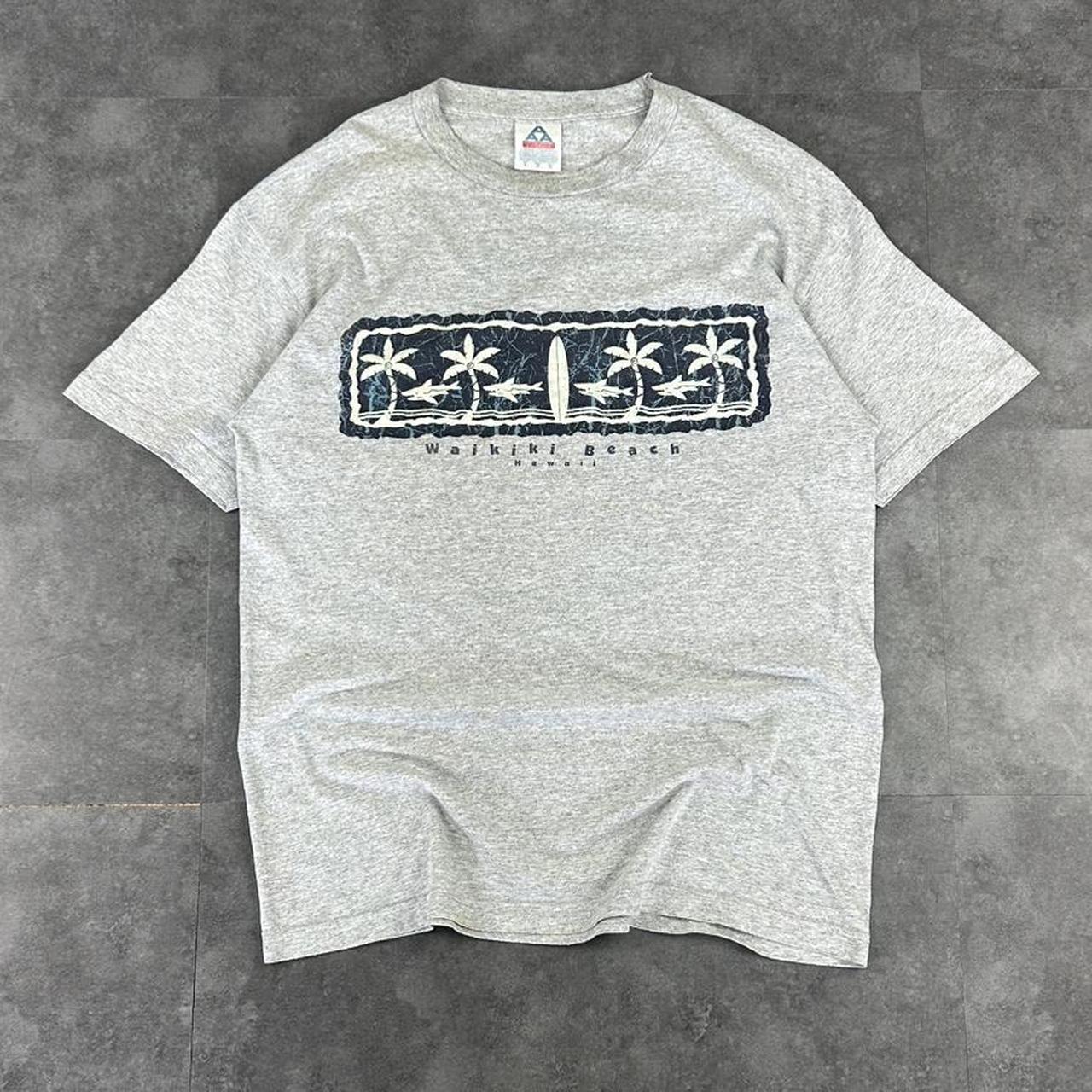 Alstyle Apparel 2000s Logo Waikiki Hawaii Tribal Pattern waves Print graphic logo T shirt