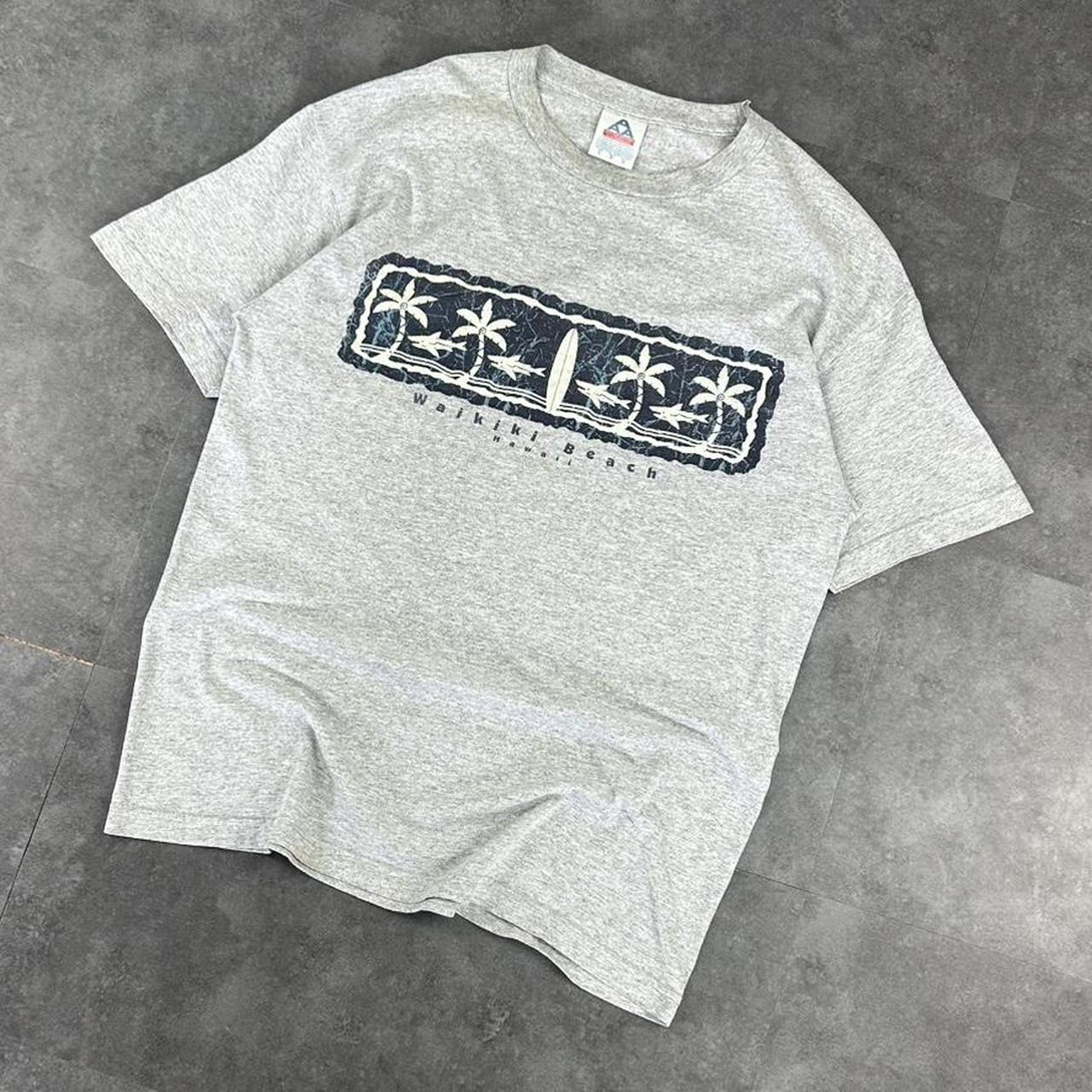 Alstyle Apparel 2000s Logo Waikiki Hawaii Tribal Pattern waves Print graphic logo T shirt