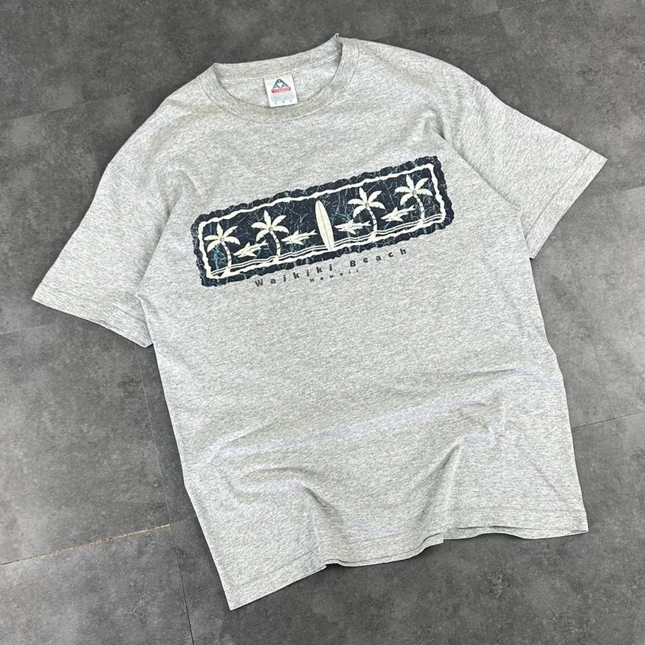 Alstyle Apparel 2000s Logo Waikiki Hawaii Tribal Pattern waves Print graphic logo T shirt