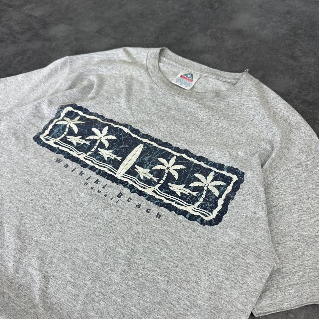Alstyle Apparel 2000s Logo Waikiki Hawaii Tribal Pattern waves Print graphic logo T shirt