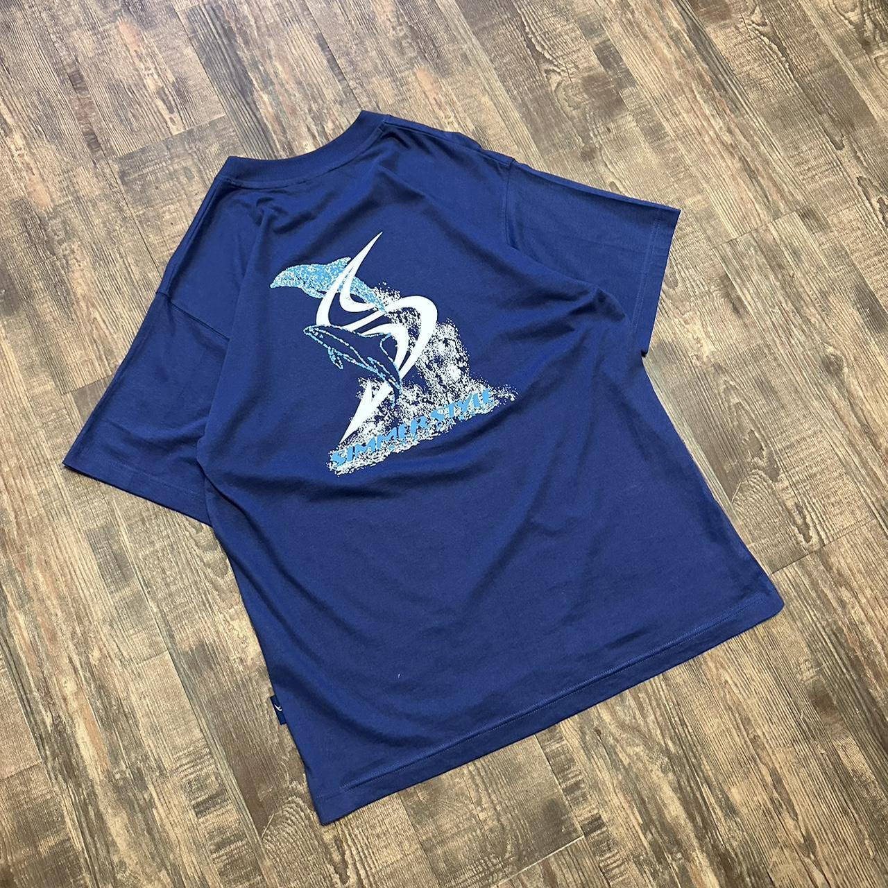 Simmerstyle 00s surf style boardcore T shirt in dark blue with big dolphin logo on back and mini bre