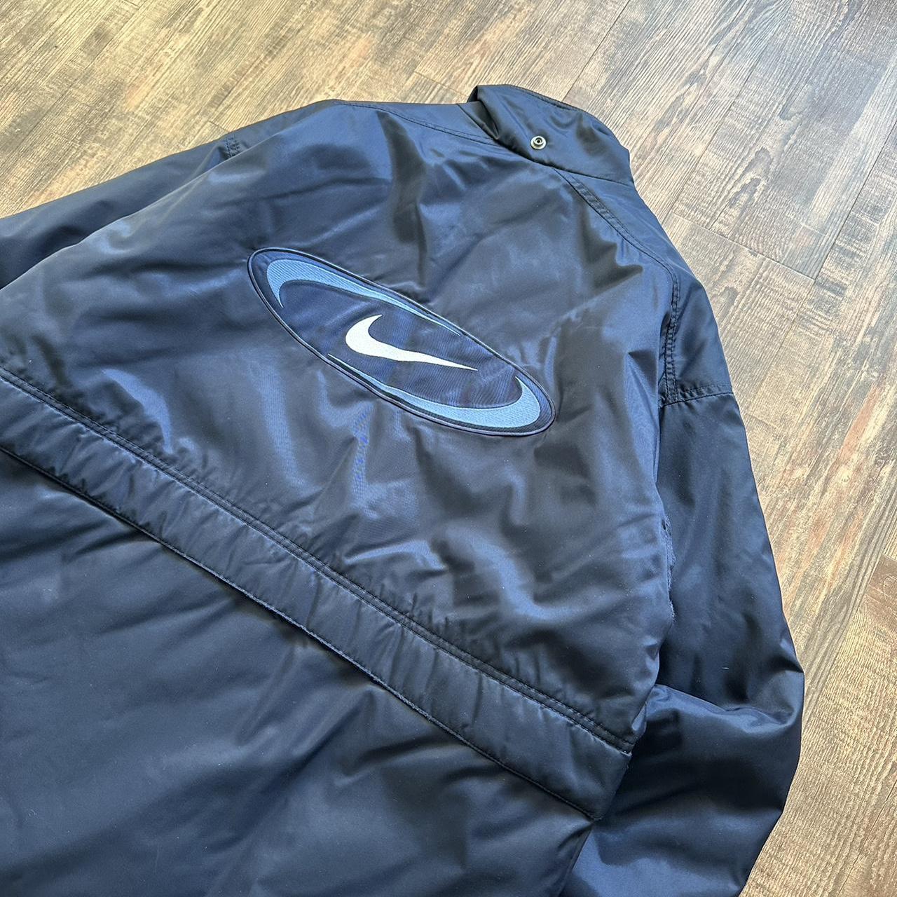 Nike 00s padded jacket in navy with big classic swoosh on back and blue padded lining