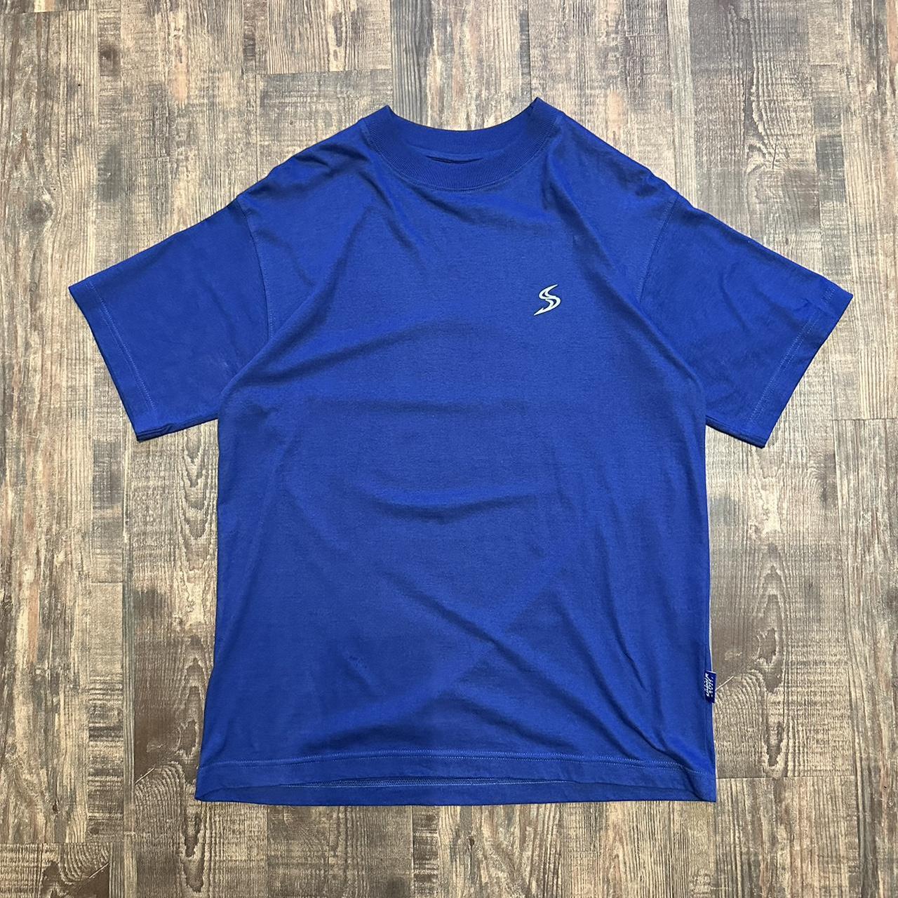 Simmerstyle 00s surf style boardcore T shirt in dark blue with big dolphin logo on back and mini bre