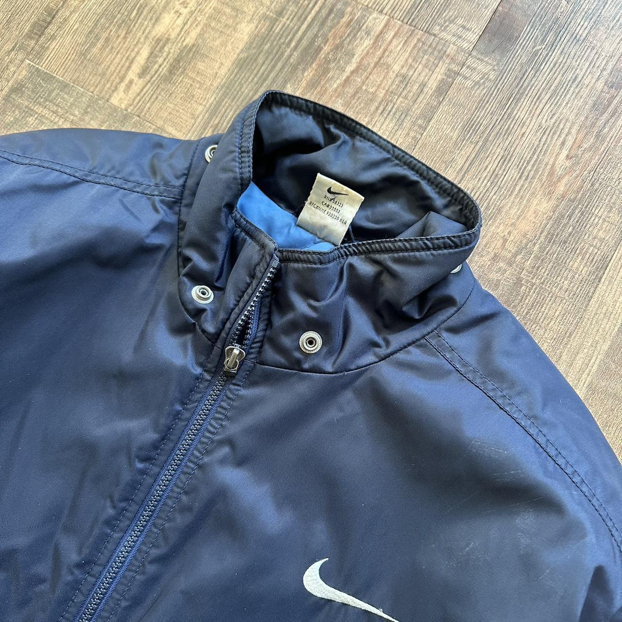 Nike 00s padded jacket in navy with big classic swoosh on back and blue padded lining