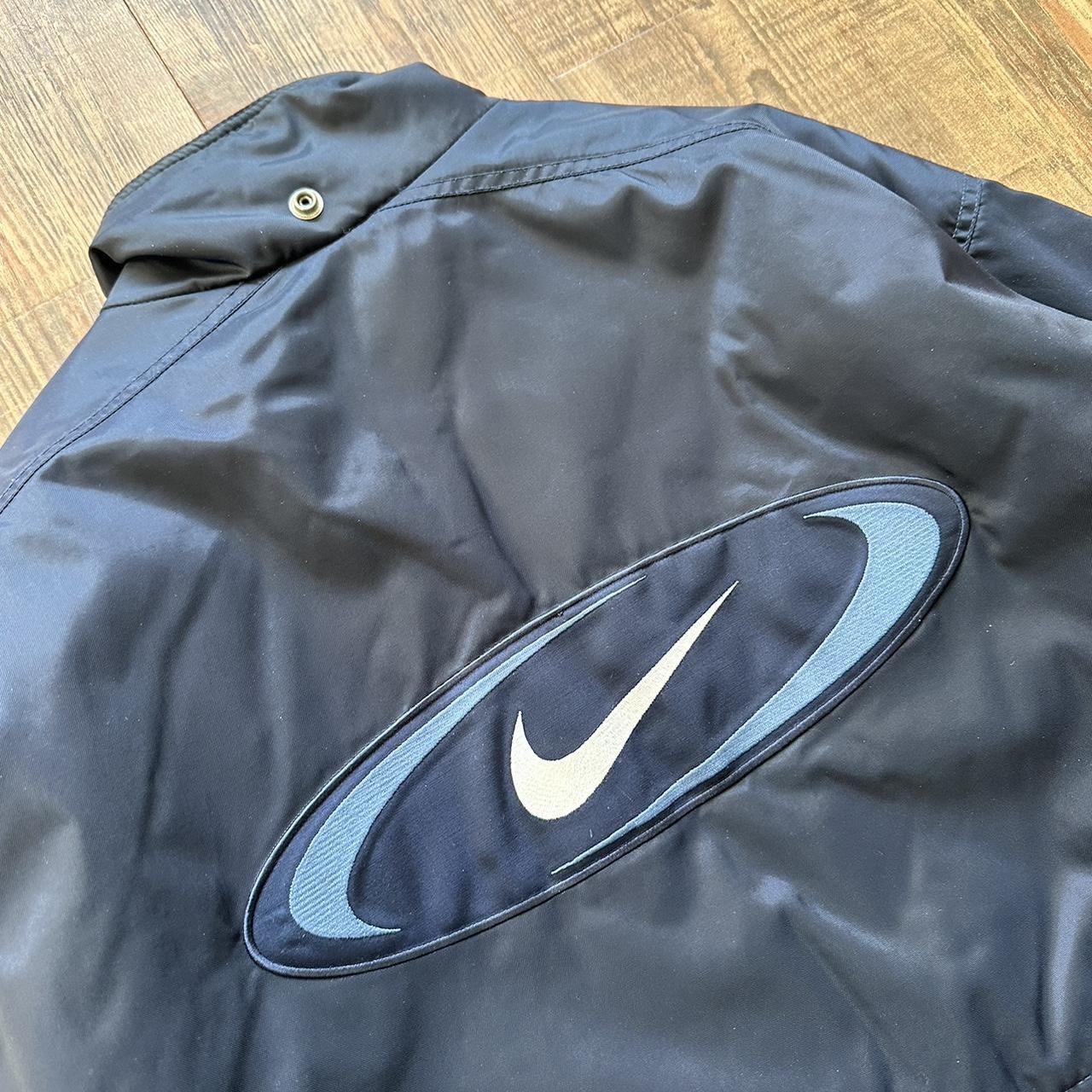 Nike 00s padded jacket in navy with big classic swoosh on back and blue padded lining