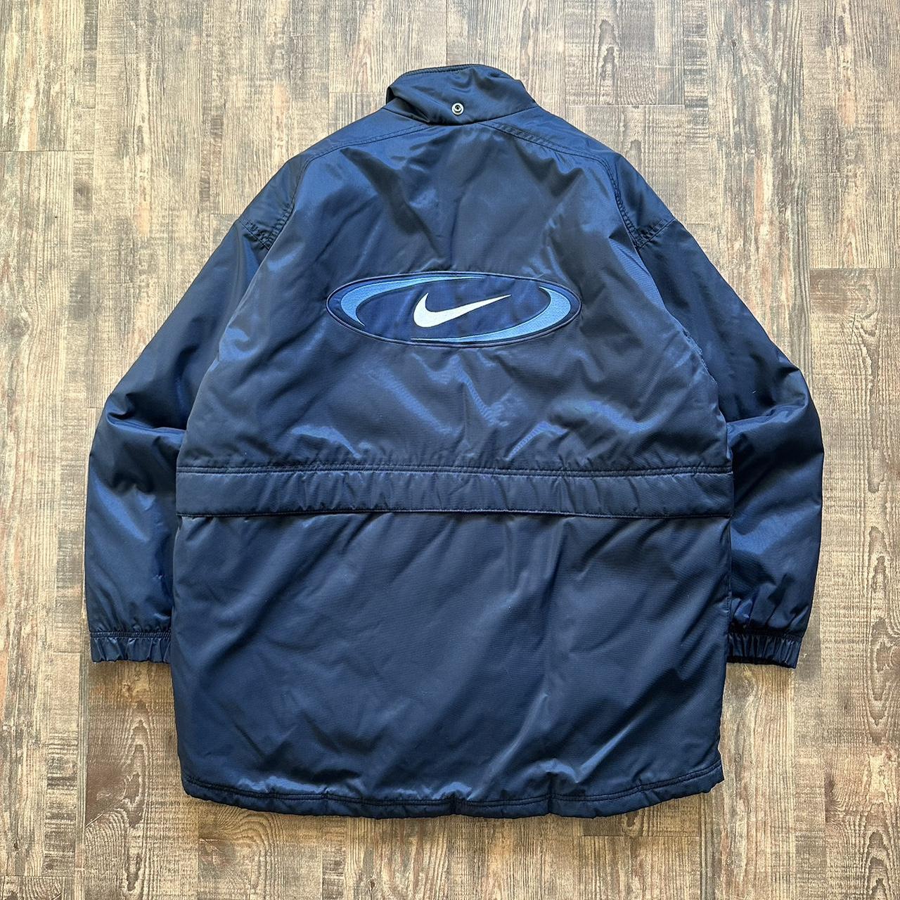 Nike 00s padded jacket in navy with big classic swoosh on back and blue padded lining