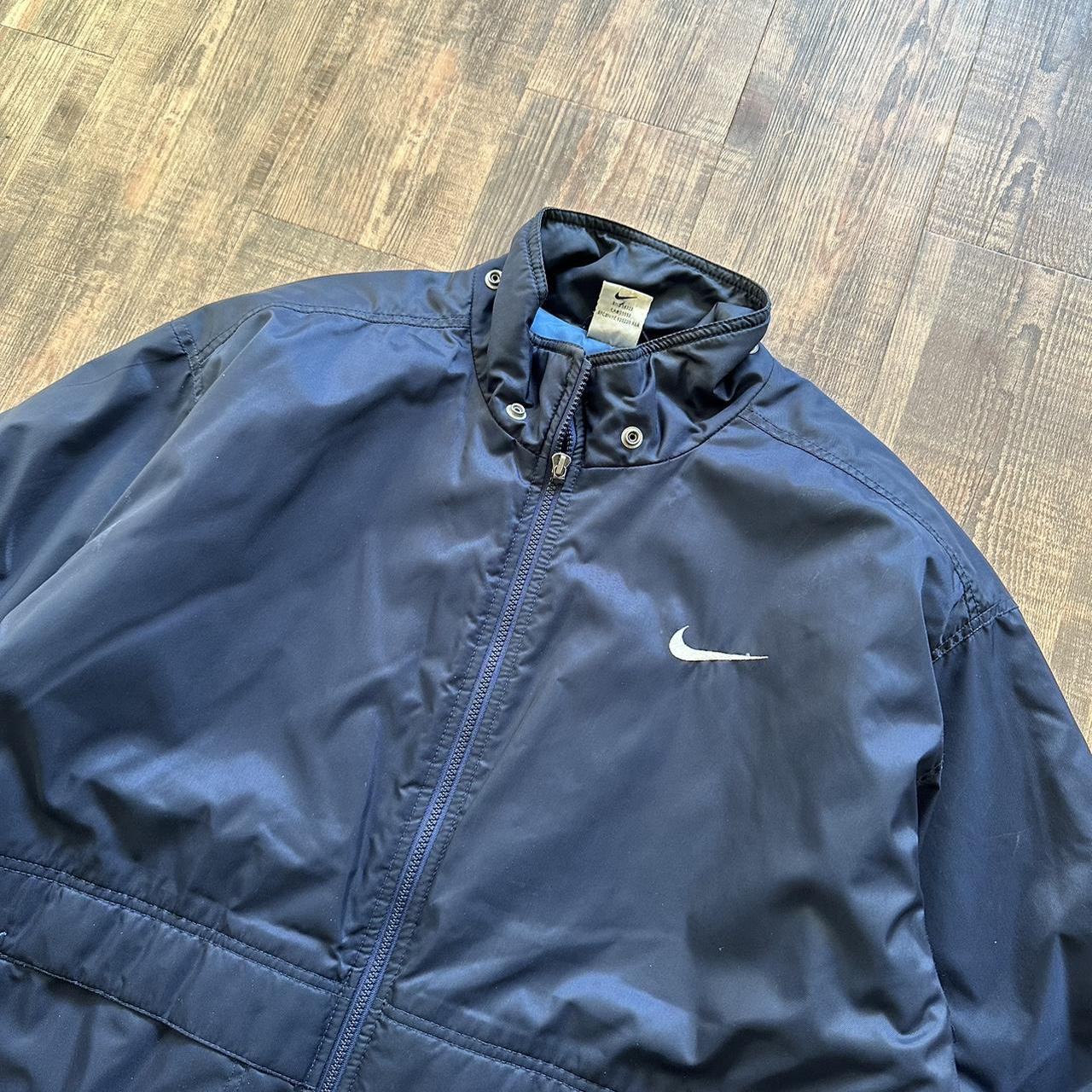 Nike 00s padded jacket in navy with big classic swoosh on back and blue padded lining