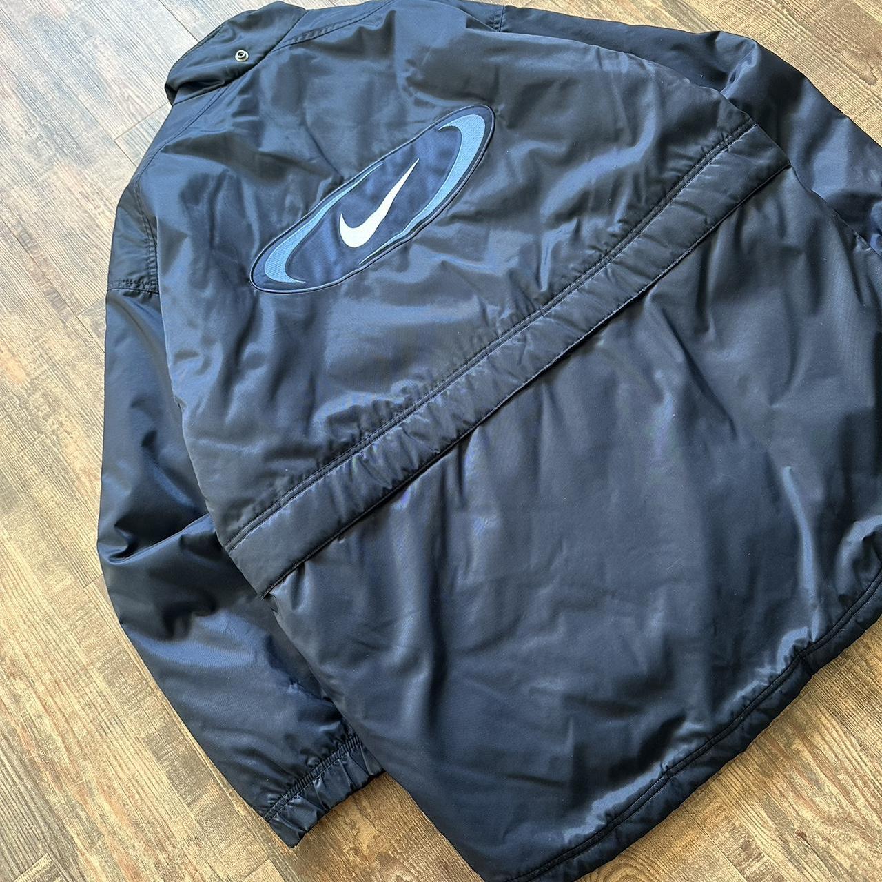 Nike 00s padded jacket in navy with big classic swoosh on back and blue padded lining